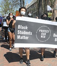 More than 100 University of Richmond students, along with faculty and staff, march Wednesday in a demonstration led by the Black Student Coalition calling for the names of Rev. Robert Ryland and Douglas Southall Freeman to be removed from campus buildings.
