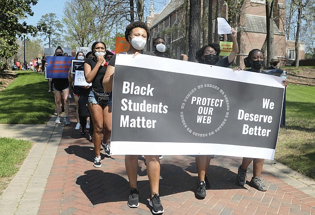 More than 100 University of Richmond students, along with faculty and staff, march Wednesday in a demonstration led by the Black Student Coalition calling for the names of Rev. Robert Ryland and Douglas Southall Freeman to be removed from campus buildings.