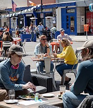 People are seen dining outdoors at a restaurant in Ann Arbor, Michigan, on April 4. Michigan is already in the middle of a violent Covid-19 surge, and one epidemiologist says other states should be paying close attention.
Mandatory Credit:	Emily Elconin/Reuters