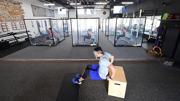 Infection risk while inside gyms is lower for fully vaccinated people, but unvaccinated people remain unprotected -- so both groups, if they go, should take the same precautions.
Mandatory Credit:	Frederic J. Brown/AFP/Getty Images