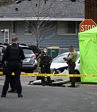 The Minnesota National Guard was deployed overnight to the Minneapolis suburb of Brooklyn Center after crowds protested the death of a man in an officer-involved shooting and car crash on April 11. Hennepin County Sheriffs and Brookly Center Police are seen standing near a tent.
Mandatory Credit:	Aaron Lavinsky/Star Tribune/Getty Images