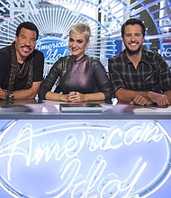 ABC's "American Idol" judge Luke Bryan, right, will sit out the program's first live show after testing positive for Covid. Judges Lionel Richie (left) and Katy Perry (center) will continue on with Paula Abdul serving as a guest judge.
Mandatory Credit:	Eric Liebowitz/ABC via Getty Images