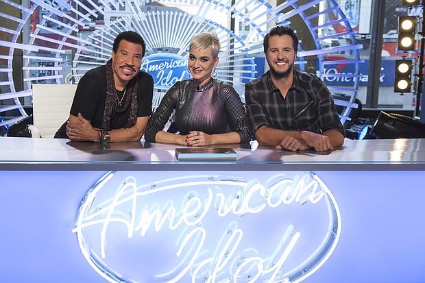 ABC's "American Idol" judge Luke Bryan, right, will sit out the program's first live show after testing positive for Covid. Judges Lionel Richie (left) and Katy Perry (center) will continue on with Paula Abdul serving as a guest judge.
Mandatory Credit:	Eric Liebowitz/ABC via Getty Images