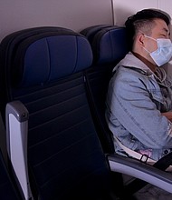 Wearing a mask onboard is still important for both vaccinated and unvaccinated passengers.
Mandatory Credit:	Michael Loccisano/Getty Images