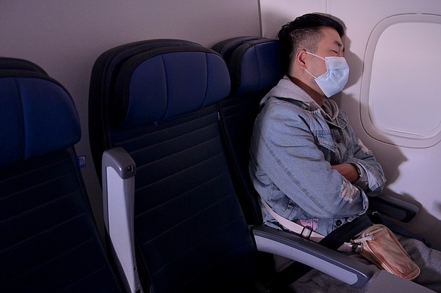 Wearing a mask onboard is still important for both vaccinated and unvaccinated passengers.
Mandatory Credit:	Michael Loccisano/Getty Images