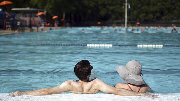Coronavirus can spread between people via respiratory droplets, air or surfaces, but the US Centers for Disease Control and Prevention isn't aware of any evidence about coronavirus spreading to people through the water in pools.
Mandatory Credit:	Anthony Behar/Sipa USA/AP