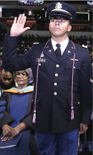 2nd Lt. Caron Nazario, who was an ROTC student at Virginia State University, is shown as he is commissioned during the university’s 2016 commencement.