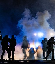 Authorities fire gas munitions at demonstrators gathered outside the Brooklyn Center Police Department to protest the shooting death of Daunte Wright on April 13 in Brooklyn Center, Minn.
Mandatory Credit: John Minchillo/AP