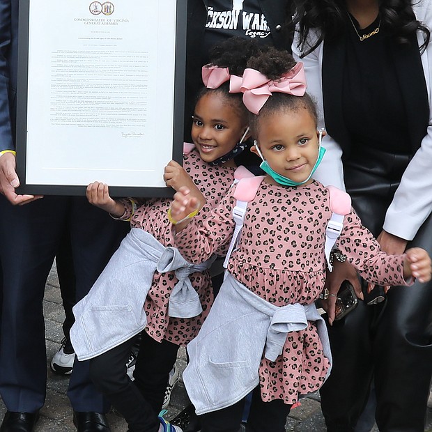 Who are these girls?-Eva Carter, 5, left, and her 3-year-old sister, Gabby Carter, are in Downtown by the Greater Richmond Convention Center.  Mayor Levar M. Stoney declared April 17 Giles B. Jackson Day and a proclamation was presented to Mr. Jackson’s descendants Saturday by state Delegates Jeff M. Bourne of Richmond and Lamont Bagby of Henrico, members of the Virginia Legislative Black Caucus at the kickoff of The JXN Project’s celebration commemorating the 150th anniversary of Jackson Ward.