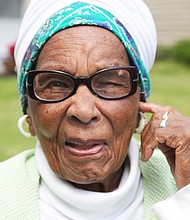 Marjorie Wilson Saunders, who touched the lives of hundreds of students during her teaching career at Richmond’s Maggie L. Walker and George Wythe high schools, is serenaded with “Happy Birthday” by family, including her daughter, Marjory, friends and former students who helped celebrate her 101st birthday on April 15.