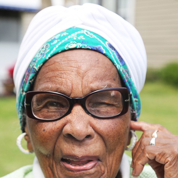 Marjorie Wilson Saunders, who touched the lives of hundreds of students during her teaching career at Richmond’s Maggie L. Walker and George Wythe high schools, is serenaded with “Happy Birthday” by family, including her daughter, Marjory, friends and former students who helped celebrate her 101st birthday on April 15.