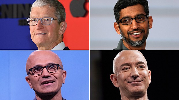 Apple is the only American company to reach a $2 trillion market value. Microsoft is worth just under $2 trillion. Amazon has a market capitalization of $1.7 trillion, and Google owner Alphabet is worth about $1.5 trillion. Their CEO's are pictured here.
Mandatory Credit:	Getty Images