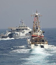 Iran's Islamic Revolutionary Guard Corps Navy (IRGCN) Harth 55, left, conducted an unsafe and unprofessional action by crossing the bow of the Coast Guard patrol boat USCGC Monomoy, right, as the US vessel was conducting a routine maritime security patrol in international waters of the southern Arabian Gulf on April 2.
Mandatory Credit:	US Navy