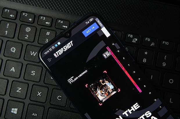 NBA Top Shot allows users to procure a collection of digital basketball highlights.
Mandatory Credit:	Rokas Tenys/Alamy Stock Photo