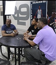 (Left to Right) Kenneth Johnson-Gamble,  Coach Cartier Martin and Coach DJ Anderson