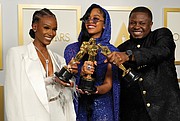 Tiara Thomas, from left, H.E.R. and Dernst Emile II, winners of the award for best original song for “Fight For You” from “Judas and the Black Messiah.”