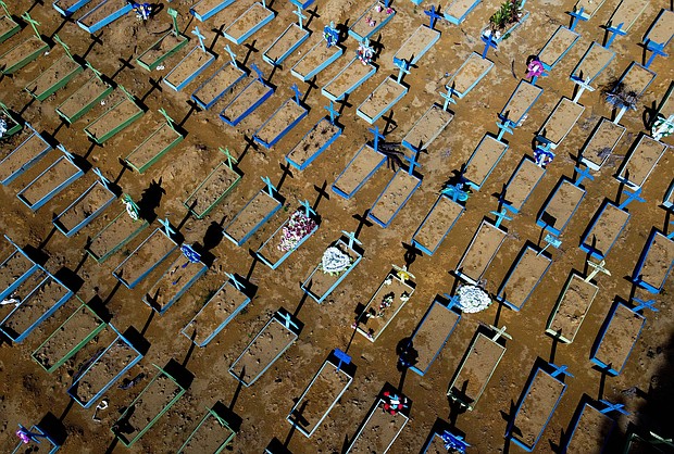 Since this year began, one third of all people who've died in Brazil were victims of Covid-19. Pictured is an aerial view of graves of COVID-19 victims at the Nossa Senhora Aparecida cemetery in Manaus, Amazon state, Brazil, on April 15, 2021.
Mandatory Credit:	Michael Dantas/AFP/Getty Images