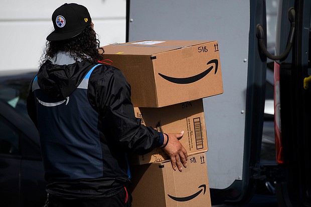 Amazon reported a whopping $8.1 billion in quarterly net income, up 224% from the same period in the prior year, crushing Wall Street analysts' prediction of $4.98 billion. An Amazon.com Inc. delivery driver carries boxes into a van outside of a distribution facility on February 2, 2021 in Hawthorne, California.
Mandatory Credit:	Patrick T. Fallon/AFP/Getty Images