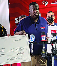 Pictured right to left: Everett Rand, of Chicago Football Classic, Reginal Steele, of Sherman Dodge, Larry Huggins, of Christmas in the Wards and Chicago Football Classic. Sherman Dodge partnered
with Chicago Football Classic and Christmas in the Wards to donate $100,000 to 13 organizations across the Chicagoland area. Photos provided by J. Berry