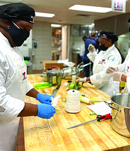Hamet Andrewin, left, wanted to participate in the UNITE HERE Chicago Culinary Apprenticeship Class because he wanted to perfect his skills as a chef. Photos provided by UNITE HERE