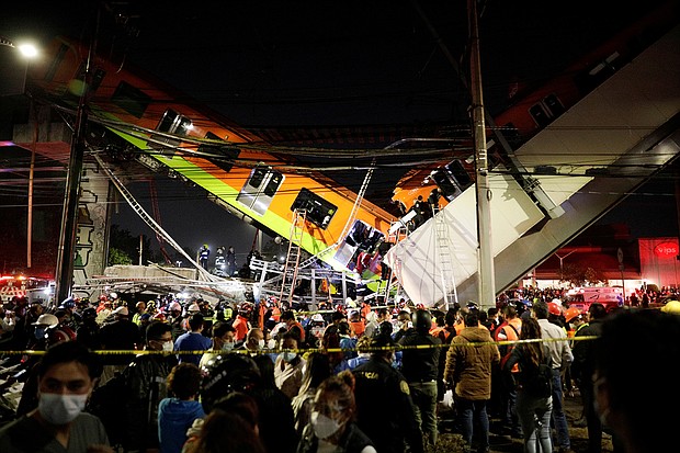 Rescuers work at a site where an overpass for a metro partially collapsed with train cars on it at Olivos station in Mexico City, Mexico May 3.
Mandatory Credit: Luis Cortes/Reuters