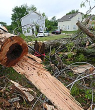 A damaged tree sits on the side of Elvis Presley Drive in Tupelo, Mississippi on May 4.
Mandatory Credit:	Thomas Graning/AP