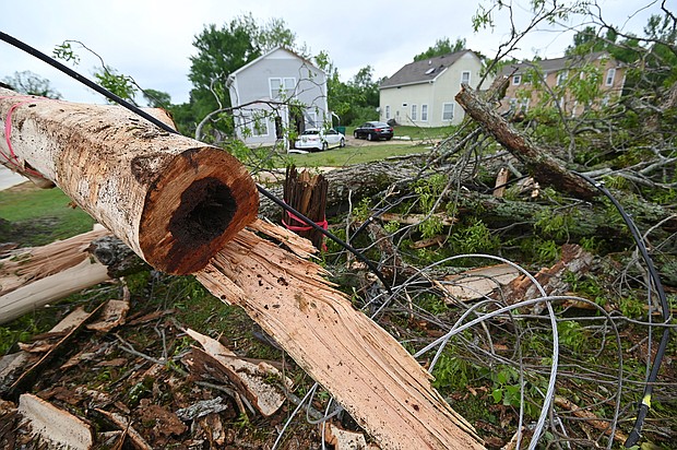 A damaged tree sits on the side of Elvis Presley Drive in Tupelo, Mississippi on May 4.
Mandatory Credit: Thomas Graning/AP