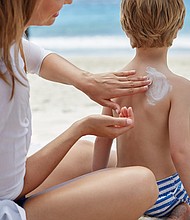 Consumers should prioritize safe sun practices, like wearing a hat and a tee, in conjunction with applying sunscreen, the Environmental Working Group suggests.
Mandatory Credit:	Science Photo Library/Getty Images
Dateline: