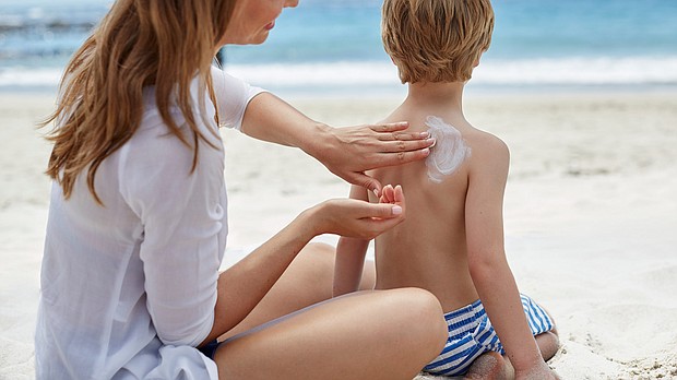 Consumers should prioritize safe sun practices, like wearing a hat and a tee, in conjunction with applying sunscreen, the Environmental Working Group suggests.
Mandatory Credit:	Science Photo Library/Getty Images
Dateline: