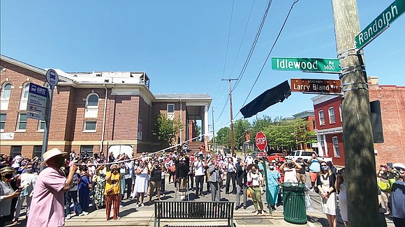 Fans of legendary Richmond gospel performer Larry Bland applaud and cheer Sunday afternoon as Russell Bennett, a longtime friend of ...