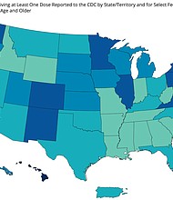 States in darker blue have a higher percentage of adults that has received at least one Covid-19 vaccine dose, according to CDC data.
Mandatory Credit:	CDC