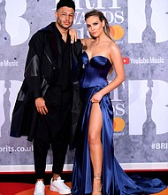 Little Mix star Perrie Edwards has announced that she is expecting her first child with England footballer Alex Oxlade-Chamberlain.
Mandatory Credit:	Ian West/PA Images/Getty Images