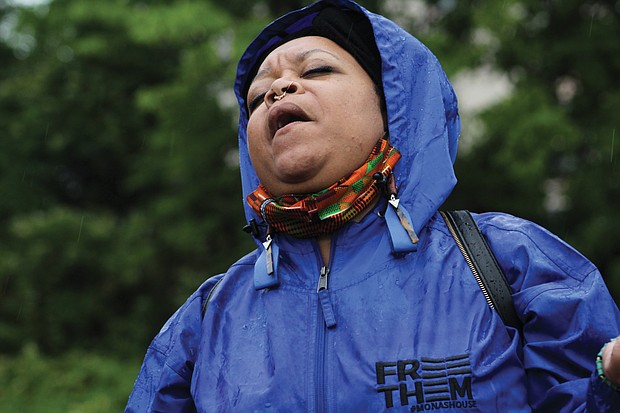 Drea d’Nur sings a song of freedom as The FreeTHEM Walk reaches Lumpkin’s Jail site, known as the “Devil’s Half-Acre,” in Richmond’s Shockoe Bottom.