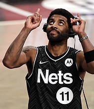 Brooklyn Nets guard Kyrie Irving reacts after his team defeated the Boston Celtics March 11 in New York.