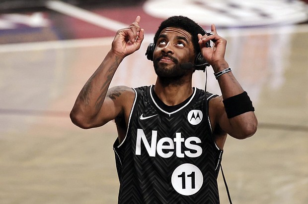 Brooklyn Nets guard Kyrie Irving reacts after his team defeated the Boston Celtics March 11 in New York.