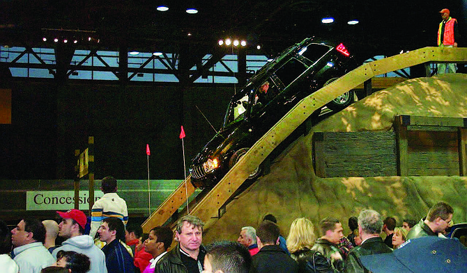 A Jeep on an artificial hill at the Chicago Auto Show in 2007. Recently, elected officials announced the return of the annual Chicago Auto Show, a marquee event that draws tourists from around the world.