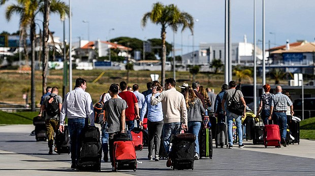 Travelers from the UK arrive in Portugal on the first day of post-restriction travel.
Mandatory Credit:	PATRICIA DE MELO MOREIRA/AFP via Getty Images