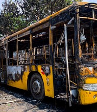 Buses from the Yangon Bus Service (YBS), which were burnt, are seen in Yangon on April 12 as the country remains in turmoil after the February military coup.
Mandatory Credit:	STR/AFP/Getty Images