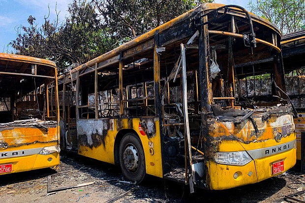 Buses from the Yangon Bus Service (YBS), which were burnt, are seen in Yangon on April 12 as the country remains in turmoil after the February military coup.
Mandatory Credit: STR/AFP/Getty Images
