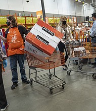 Home Depot reported sales and earnings for the first quarter May 18 that topped forecasts. The rising price of lumber and other inflation pressures have helped Home Depot, whose stock has surged 20% so far this year.
Mandatory Credit:	David Paul Morris/Bloomberg/Getty Images