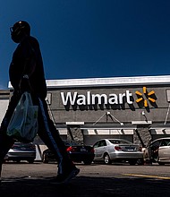 The latest round of federal stimulus payments of up to $1,400 per person lifted sales at Walmart, the largest retailer in the United States, as shoppers used their checks to buy clothing, home goods and other merchandise at stores and online.
Mandatory Credit:	David Paul Morris/Bloomberg/Getty Images
