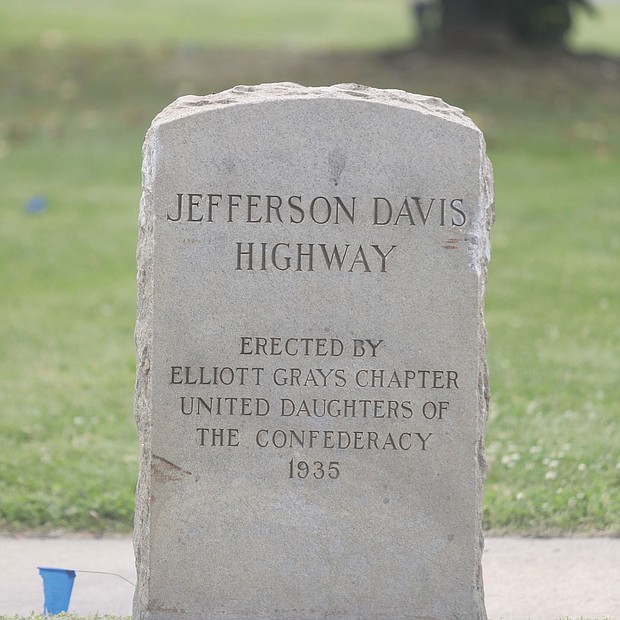 Cityscape-City Hall has not been able to remove this stone highway marker noting that a stretch of U.S. 1 in South Side, now known as Richmond Highway, was once called Jefferson Davis Highway to honor the traitorous Confederate president. Location: A grassy strip in front of the city Department of Public Utilities’ Field Operations and Maintenance Facility at Maury Street and Richmond Highway.  A Richmond chapter of the United Daughters of the Confederacy placed the 4-foot-tall marker on the site in 1935. City Council voted last December to change the name of the roadway. Robert Steidel, the city’s chief operating officer, stated Tuesday that this is one of a series of markers placed by the UDC along U.S. 1 in the city and other locations. He said all are listed on the National Register of Historic Places, which complicates their removal. He stated that city staff is working with the Virginia Department of Historic Resources to come up with a plan to remove the marker. The plan will be presented first to the City Planning Commission. Meanwhile, the Virginia General Assembly, which nearly 100 years ago designated U.S. 1 as Jefferson Davis Highway, this year approved replacing the Davis name with Emancipation Highway as of Jan. 1, 2022, in localities such as Chesterfield County that have not renamed the roadway.