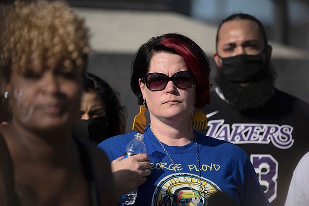 Courteney Ross, girlfriend of George Floyd, attends a rally and march organized by families who were victims of police brutality Monday, May 24, in St. Paul, Minnesota.
Mandatory Credit:	Christian Monterrosa/AP