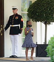 For her father / Gianna Floyd, the 7-year-old daughter of the late George Floyd, takes an ice cream break during the Floyd family’s meeting at the White House with President Biden and Vice President Harris on Tuesday, the first anniversary of her father’s death at the hands of Minneapolis police. According to reports, the youngster told the president she was hungry and asked if he had any snacks. He responded by providing ice cream, Cheetos and chocolate milk. While the meeting may have proved a little much for the youngster, family members left optimistic about prospects for Senate passage of a police reform package named for George Floyd.