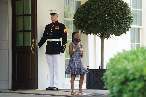 For her father / Gianna Floyd, the 7-year-old daughter of the late George Floyd, takes an ice cream break during the Floyd family’s meeting at the White House with President Biden and Vice President Harris on Tuesday, the first anniversary of her father’s death at the hands of Minneapolis police. According to reports, the youngster told the president she was hungry and asked if he had any snacks. He responded by providing ice cream, Cheetos and chocolate milk. While the meeting may have proved a little much for the youngster, family members left optimistic about prospects for Senate passage of a police reform package named for George Floyd.