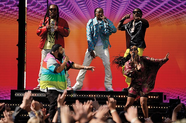 DJ Khaled, front left, and H.E.R., front right, perform with Takeoff, from background left, Quavo and Offset, of Migos, at the Billboard Music Awards on Sunday at the Microsoft Theater in Los Angeles.