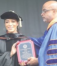 VSU President Makola M. Abdullah, presents commencement speaker Angela Rye with the Presidential Humanitarian Award.