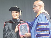 VSU President Makola M. Abdullah, presents commencement speaker Angela Rye with the Presidential Humanitarian Award.