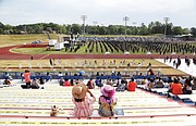 Graduates’ families and friends are seated socially distanced in the stadium during Virginia State University’s commencement.
