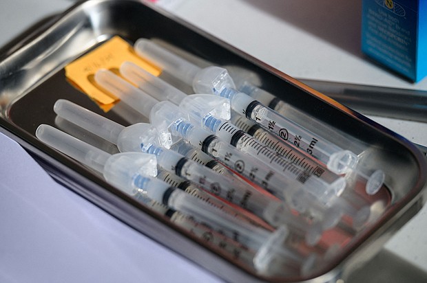 Syringes with the Moderna Covid-19 vaccine lay on a table at a pop up vaccine clinic at the Jewish Community Center on April 16 in the Staten Island borough of New York City.
Mandatory Credit:	Angela Weiss/AFP/Getty Images
